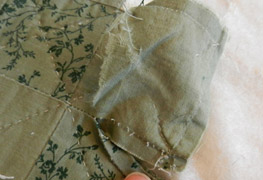 Removing the damaged fabric.